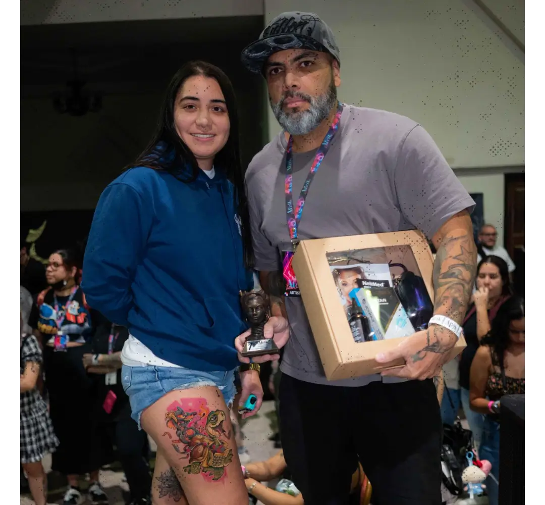 Cristian Pacheco — international tattoo convention Cristian Pacheco with an international client at a tattoo convention