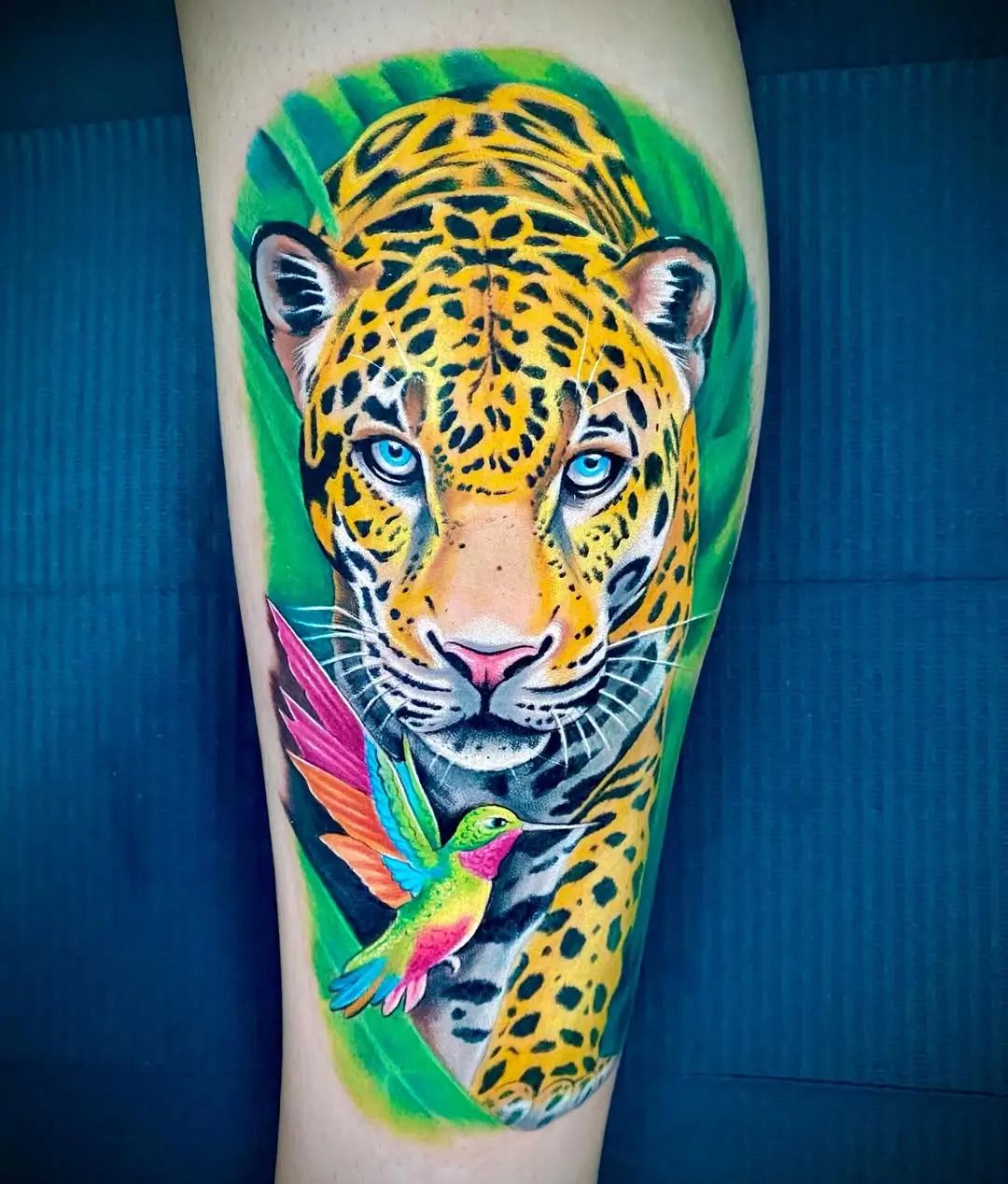 Color realism tattoo — Cristian Pacheco Madrid Color realism jaguar and hummingbird tattoo by Cristian Pacheco in Madrid